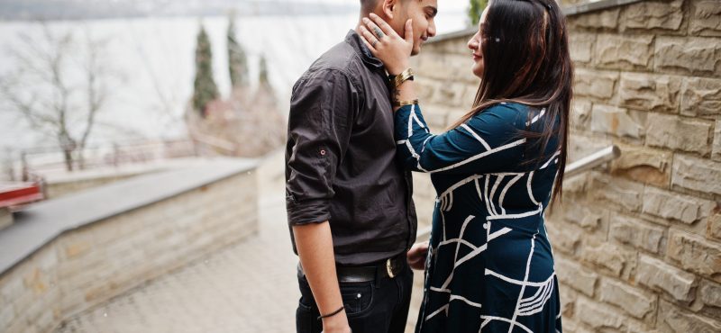 Love story of indian couple posed outdoor.