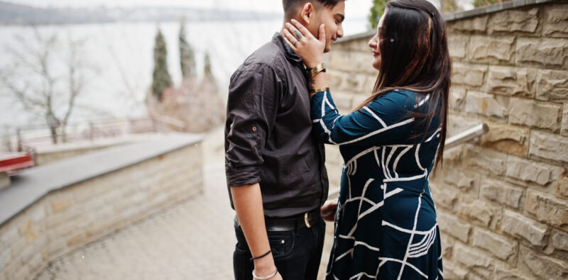 Love story of indian couple posed outdoor.